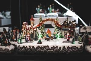 Christmas decorations with moving figurines on a winter background photo