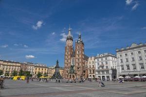 historic church in the old town square in krakow, poland on a summer holiday day photo