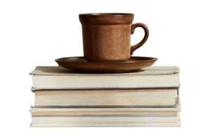 Books and brown cup isolated on a transparent background png