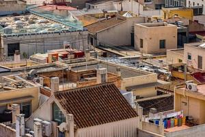 view on a sunny day of the city and colorful buildings from the viewpoint Alicante Spain photo