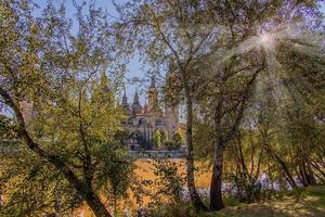 September autumn view of the cathedral and the river in Zaragoza in Spain on a warm sunny day photo