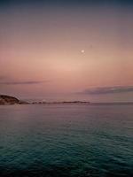 sunset landscape of alicante spain with moon photo