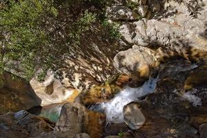 a natural wild landscape in the Turkish mountains with an interesting waterfall and the sapadere canyon photo