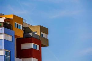 abstract colorful building in Alicante Spain over blue sky background photo