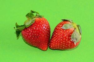 Strawberries on green background photo