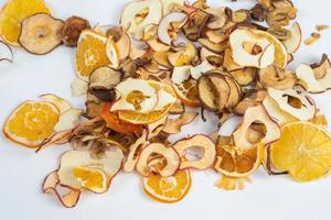 Dried fruits isolated on white background. Healthy eating concept. Top view. Healthy vegetarian food concept. Dried fruit chips. photo