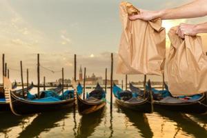 food delivery in paper bags against the background of Italy photo