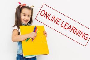 little girl on distance learning online photo