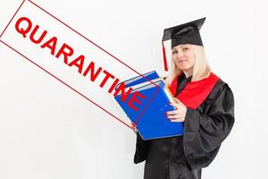 Quarantine at school. Student graduate, wearing mantle isolated on white background. photo