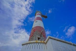 Lighthouse by the sea photo