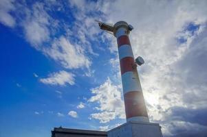 Lighthouse by the sea photo