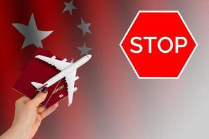 Airplane in hand with national flag on background series - China photo