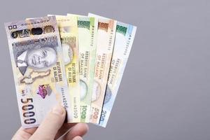 Malawian money on gray background photo