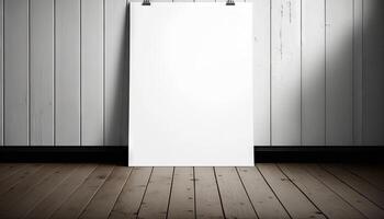 Blank white paper poster on plank wooden floor and wall. photo