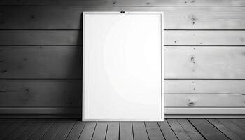 Blank white paper poster on plank wooden floor and wall. photo