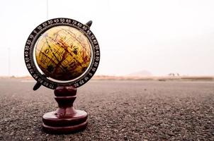 Globe on the road photo