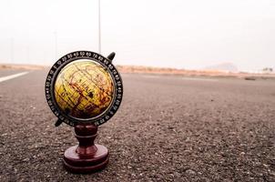 Globe on the road photo