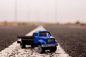 Toy truck on the road photo