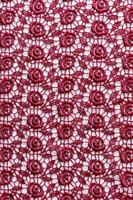 lace vintage burgundy background. Retro style. background for designers. vertical view. photo