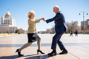 Elderly couple have fun at city street. photo