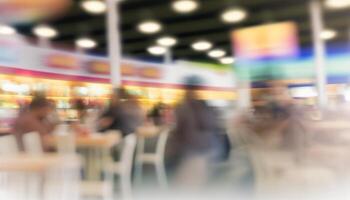 Abstract blur food court in shopping mall for background. photo