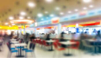 Abstract blur food court in shopping mall for background. photo