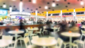 Abstract blur food court in shopping mall for background. photo