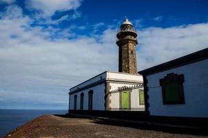 Lighthouse by the sea photo