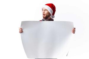 emotional man in New Year's clothes holding a banner holiday copy-space studio photo