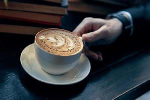 Cup of coffee cappuccino close-up cafe breakfast photo