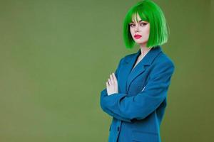 Portrait of a charming lady fun gesture hands green hair fashion color background unaltered photo