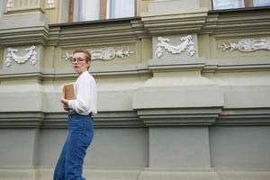 short haired woman on the street near the building rest Lifestyle photo