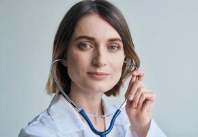 Blue stethoscope woman doctor professional worker portrait cropped view photo