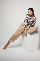 woman model appearance bright makeup leopard shirt studio photo