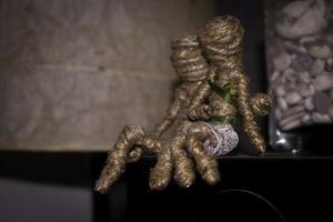 voodoo couple dolls sitting on sound system box. romantic scene photography concept photo