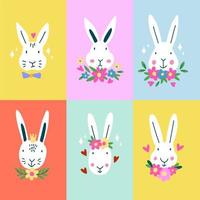 Set of cute Easter bunny rabbits with flowers. vector