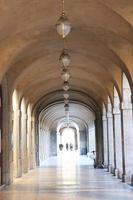 The arched yellow stone colonnade with lanterns concept photo. photo