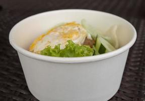 Close up photo fried rice with eggs and lettuce. The photo is suitable to use for traditional food background, poster and food content media.