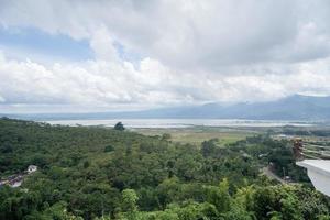 Landscape photo of green garden, up hill and flower park on the Central Java Semarang. The photo is suitable to use for traditional food background, poster and food content media.