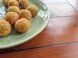 Chicken Ball on the green plate with mayonnaise sauce, snack menu on coffee shop. The photo is suitable to use for traditional food background, poster and food content media.