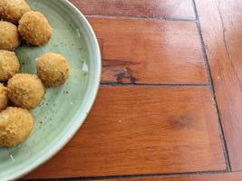 Chicken Ball on the green plate with mayonnaise sauce, snack menu on coffee shop. The photo is suitable to use for traditional food background, poster and food content media.