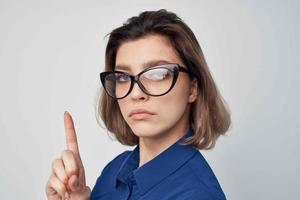 elegant woman wearing glasses blue shirt studio photo