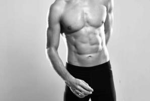 athletic man with muscular body strength exercise photo