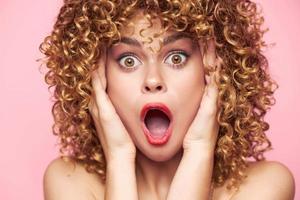 Female Frightened look wide open mouth of surprise portrait bright makeup photo