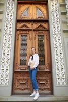 pretty woman with a book in his hands outdoors reading communication photo