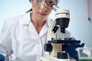 female laboratory assistant science research microbiology photo