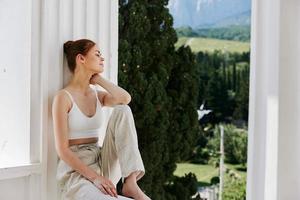 beautiful woman comfortable hotel luxurious green nature view sunny day photo