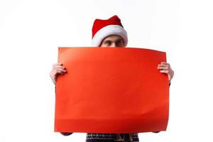 Cheerful man in a christmas hat with Red mockup poster copy-space studio photo