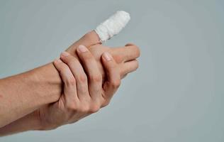 bandaged finger hand injury medicine photo