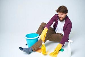 cleaner lying on the floor with a bucket of detergent cleaning service rendering Professional photo